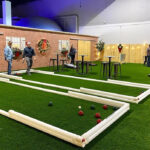 Portable bocce ball courts rented for a holiday corporate event Arcade Party Rental